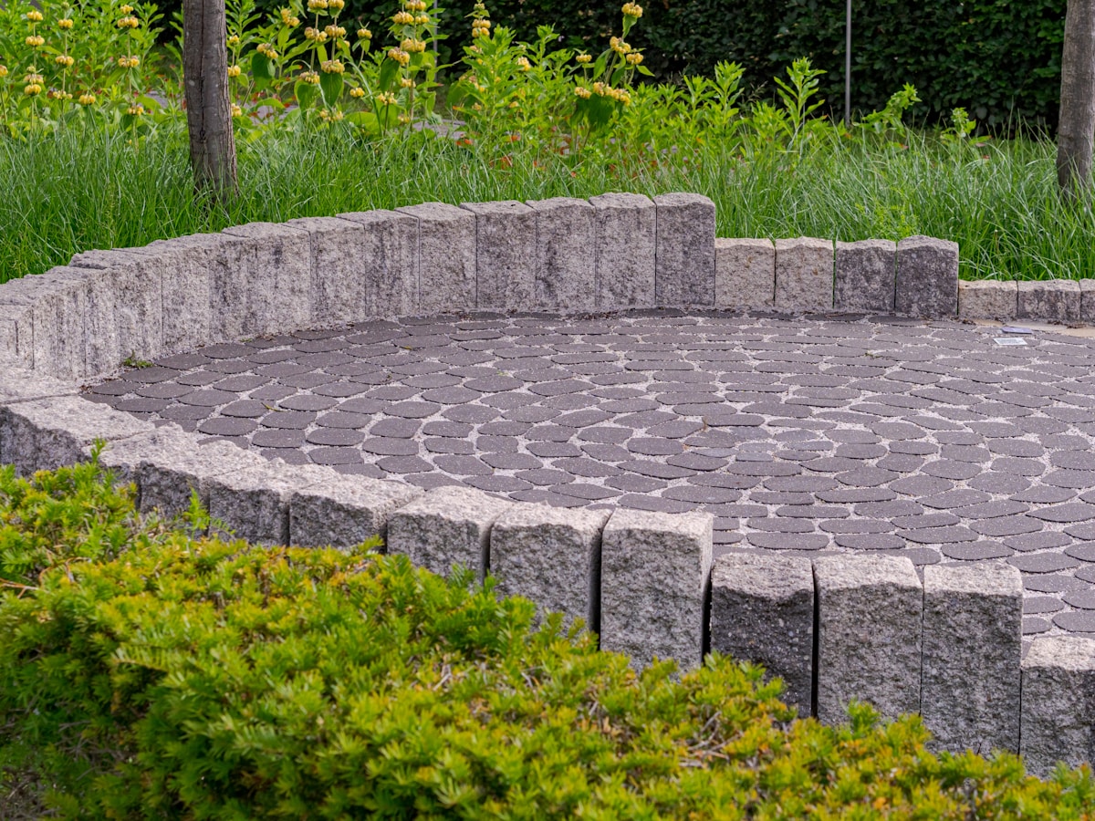 Paved patio with stone retaining wall
